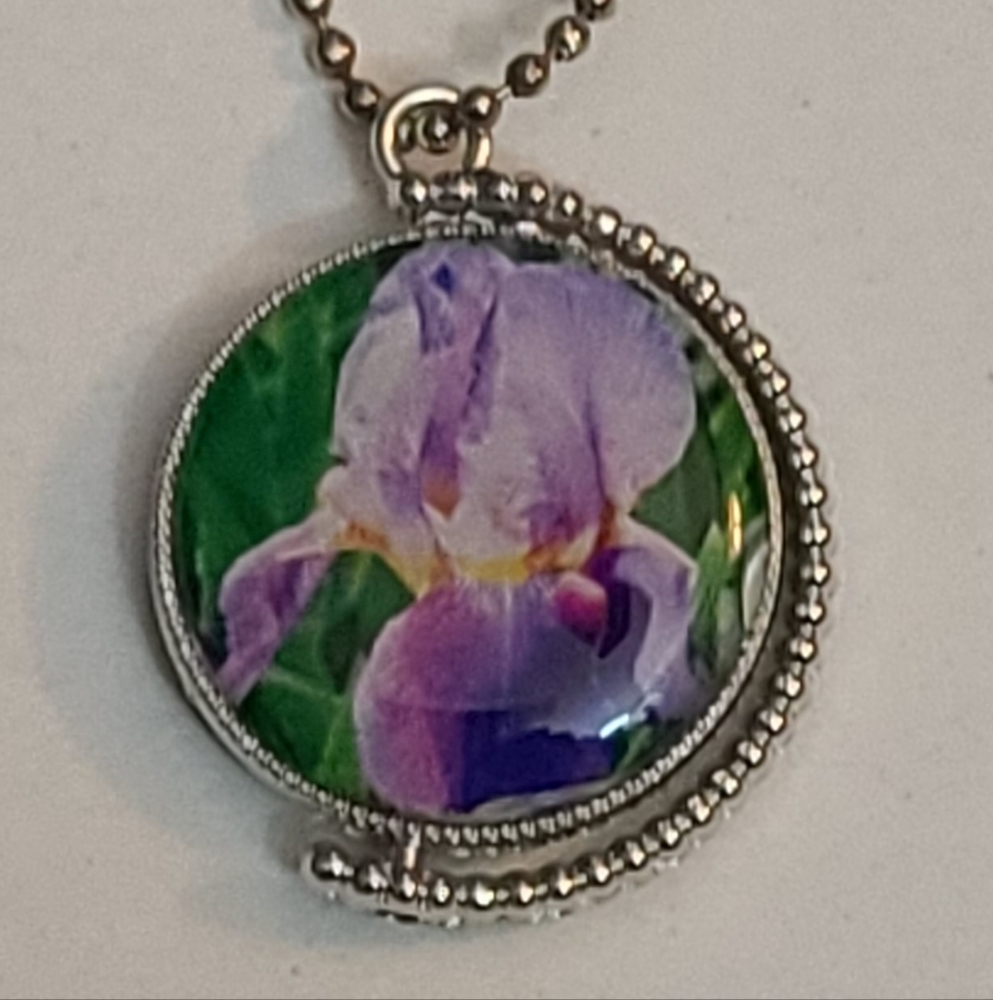 Necklace, double sided. One inch round.